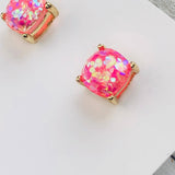 Pink gemstone earrings on a white card with 'Lauren Lane' branding.