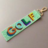 Beaded keychain with 'GOLF' in colorful letters on a light green background